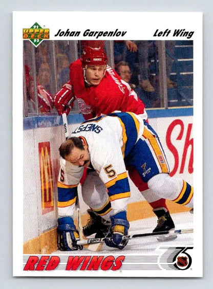 Johan Garpenlov Upper Deck hockey card featuring physical play between Red Wings and Blues