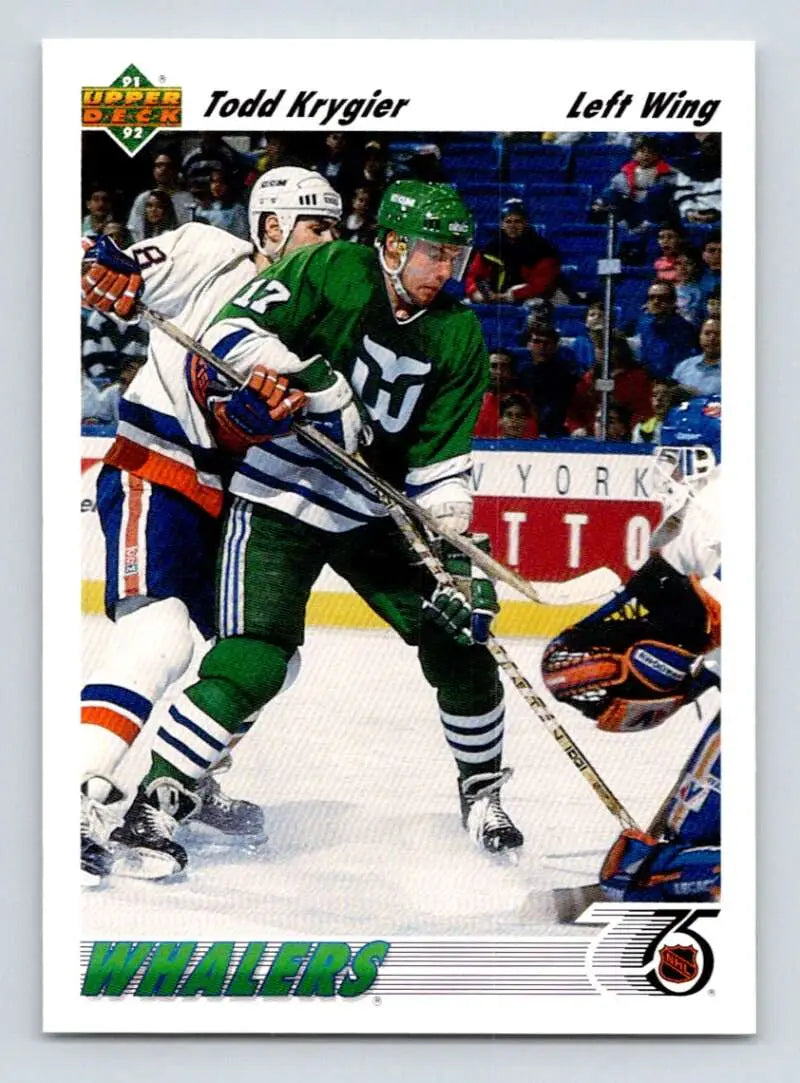 Todd Krygier in green and white Hartford Whalers jersey during game action for hockey card