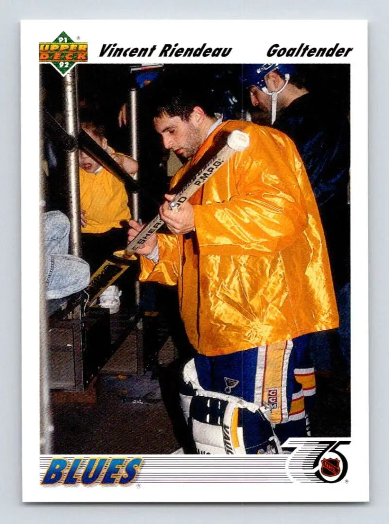 A Hockey goaltender in a bright yellow jacket representing Vincent Riendeau Upper Deck card