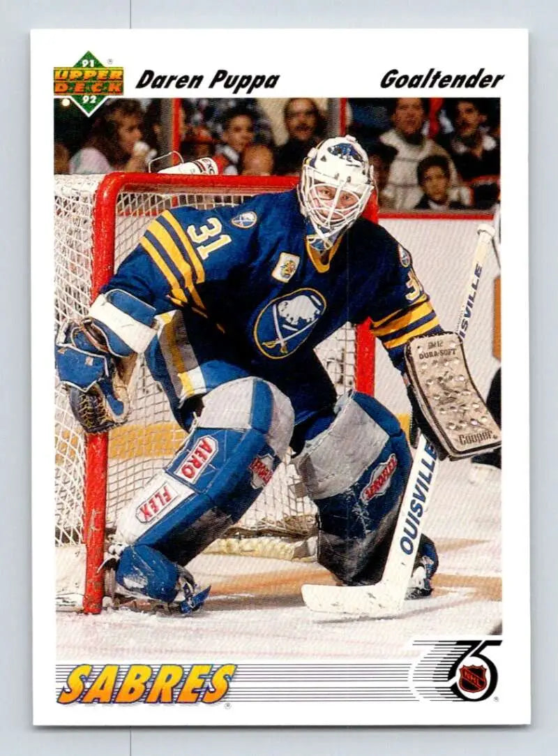 Hockey Card of Daren Puppa in Blue and Yellow Sabres Uniform Protecting the Net