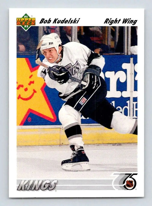 Hockey player in white Los Angeles Kings jersey, featured on Bob Kudelski hockey card