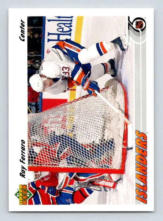 Hockey trading card of Ray Ferraro crashing into a goalie for New York Islanders Upper Deck