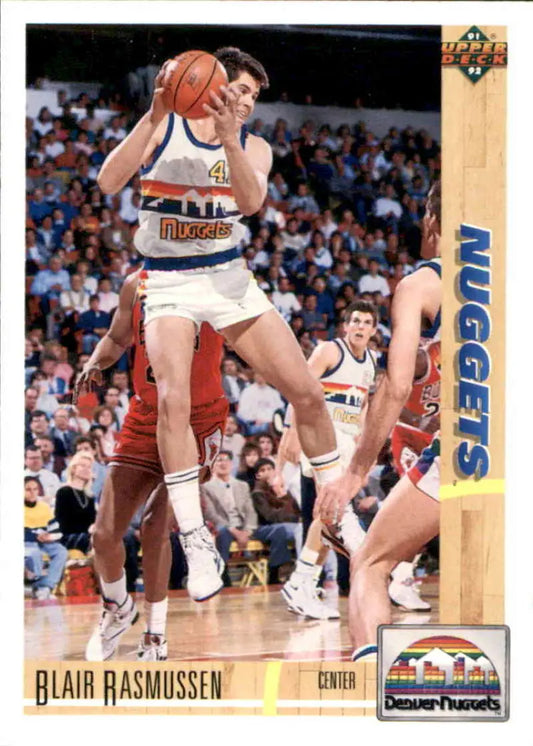 Blair Rasmussen in a white Denver Nuggets uniform jumping with basketball card