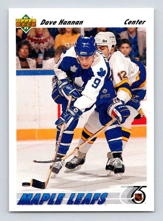 Hockey trading card featuring Toronto Maple Leafs vs Buffalo Sabres puck battle