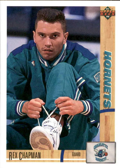 Basketball player in teal Charlotte Hornets uniform tying shoelaces for basketball card