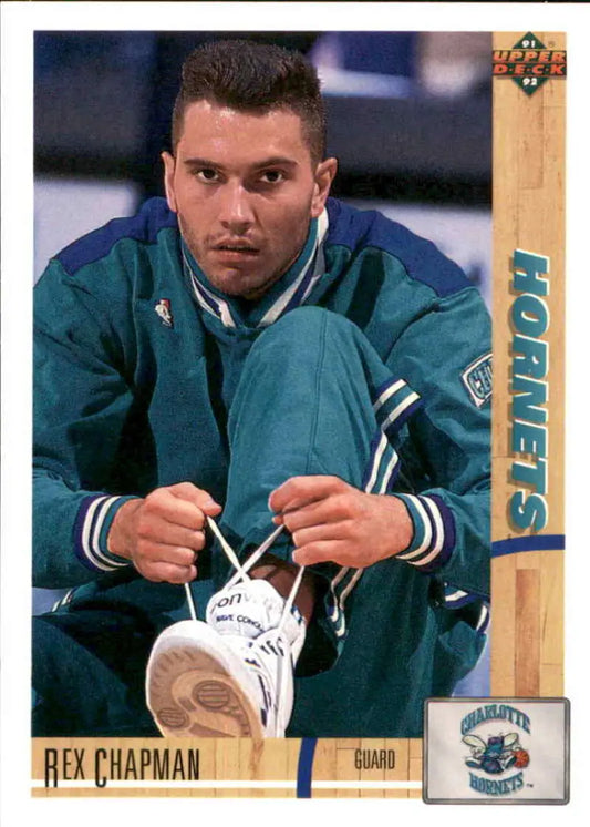 Basketball player in teal Charlotte Hornets uniform tying shoelaces for basketball card