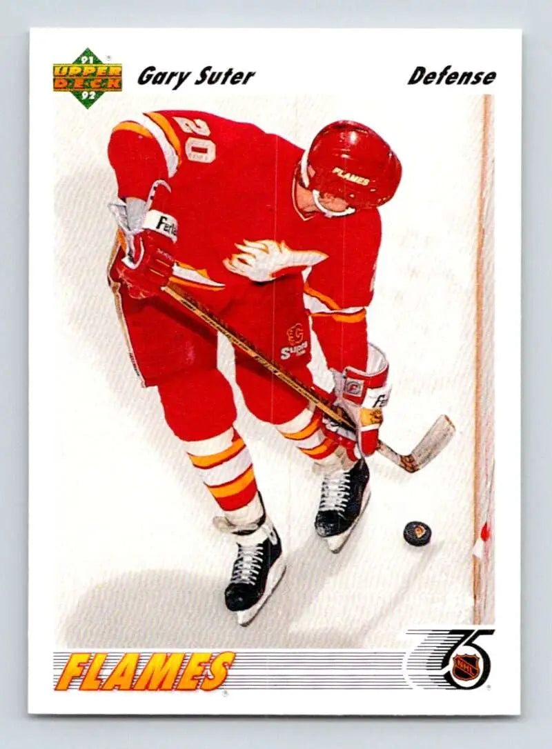 Gary Suter chasing the puck on a Calgary Flames hockey card from 1991-92 Upper Deck
