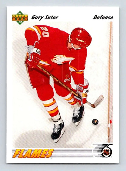 Gary Suter chasing the puck on a Calgary Flames hockey card from 1991-92 Upper Deck