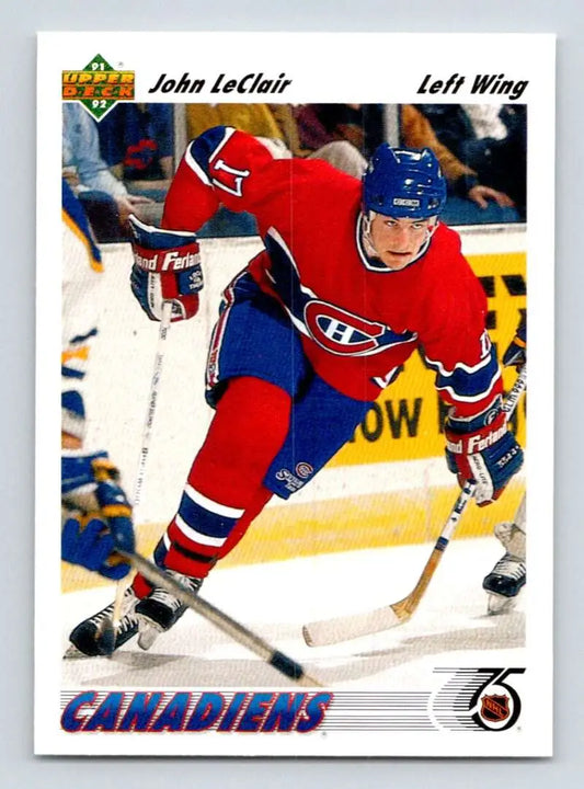 Hockey player in Montreal Canadiens uniform skating, featured on John LeClair rookie card
