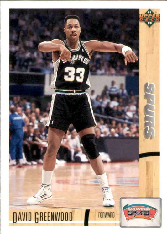 San Antonio Spurs player wearing jersey number 33 in a black and white uniform
