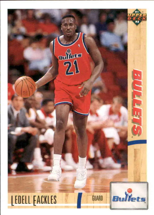 Basketball player in red Washington Bullets jersey dribbling ball on Ledell Eackles card