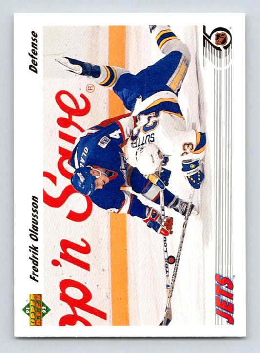 Hockey player in blue New York Rangers jersey on ice for Fredrik Olausson hockey card