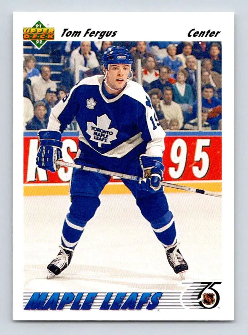 Hockey player Tom Fergus in Toronto Maple Leafs uniform skating on ice for Upper Deck card