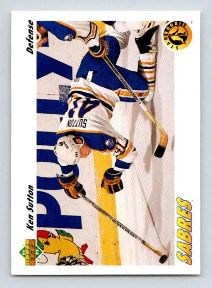 Hockey player diving in yellow and blue uniform on Ken Sutton Buffalo Sabres Hockey Card