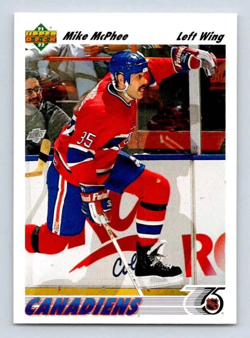 Hockey player in Montreal Canadiens uniform skating, featuring Mike McPhee card