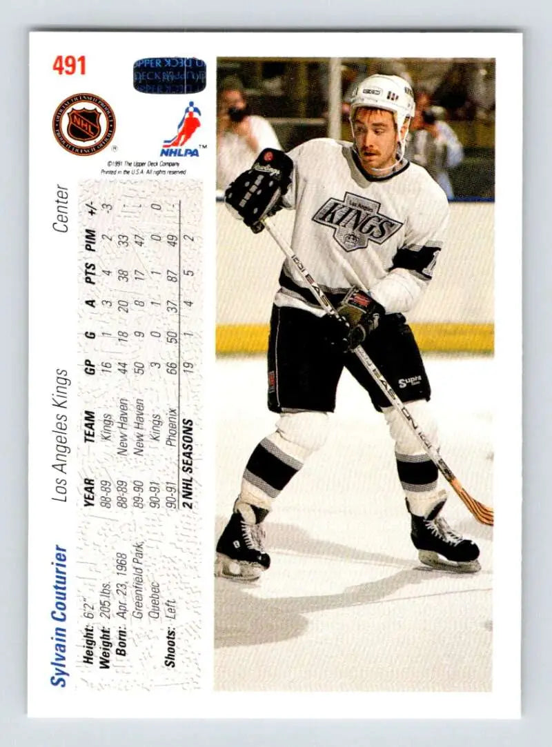 Hockey player in Los Angeles Kings uniform with stick on ice, Sylvain Couturier Upper Deck card