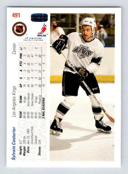 Hockey player in Los Angeles Kings uniform with stick on ice, Sylvain Couturier Upper Deck card