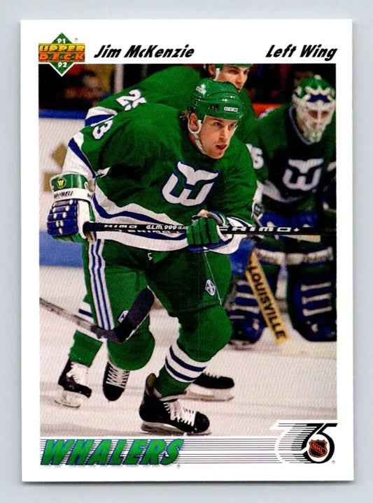Hockey player in green Hartford Whalers jersey inline with Jim McKenzie Upper Deck card