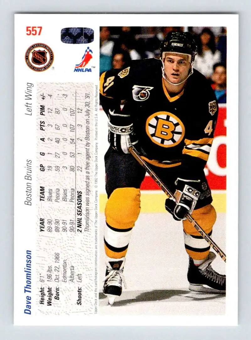 Hockey player in Boston Bruins uniform on ice for Upper Deck hockey card display