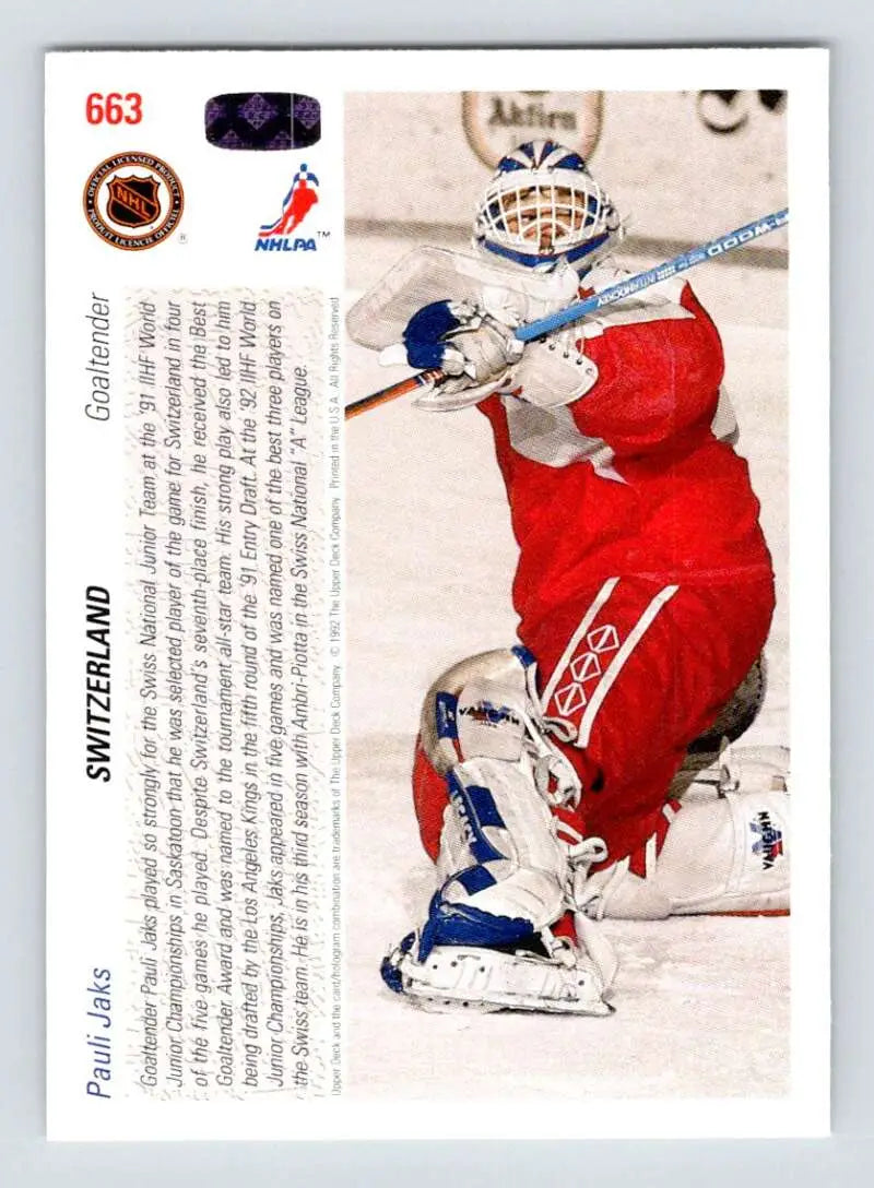Hockey goalie in red jersey making a save on Pauli Jaks Rookie Hockey Card