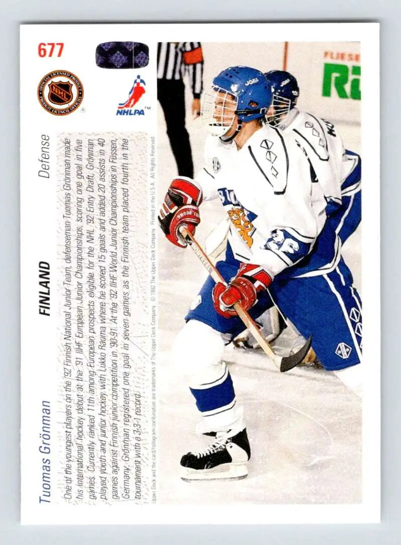 Tomas Gronman takes a shot in a blue and white uniform on the Upper Deck hockey card
