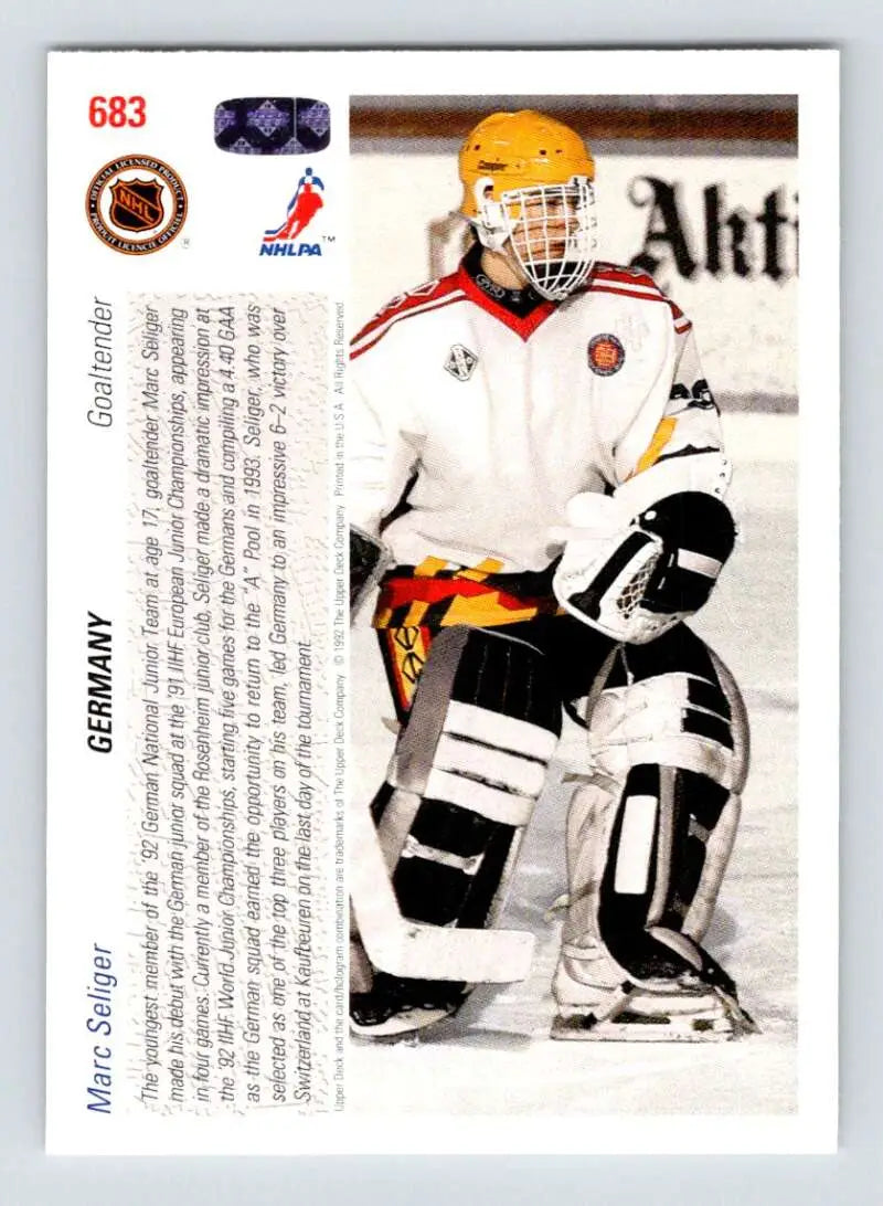 Hockey goalie in yellow helmet and white jersey featured on Marc Seliger Upper Deck hockey card