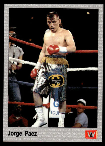 Jorge Paez in Batman-logo shorts and red gloves at a boxing ring for boxing card