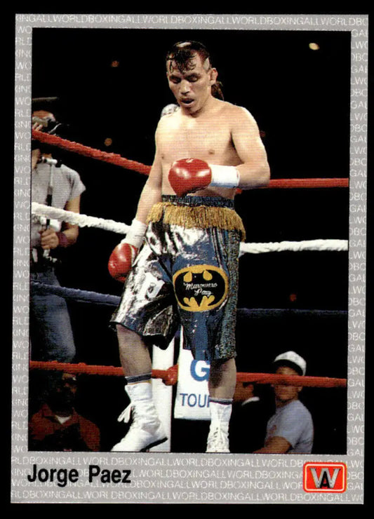 Jorge Paez in Batman-logo shorts and red gloves at a boxing ring for boxing card