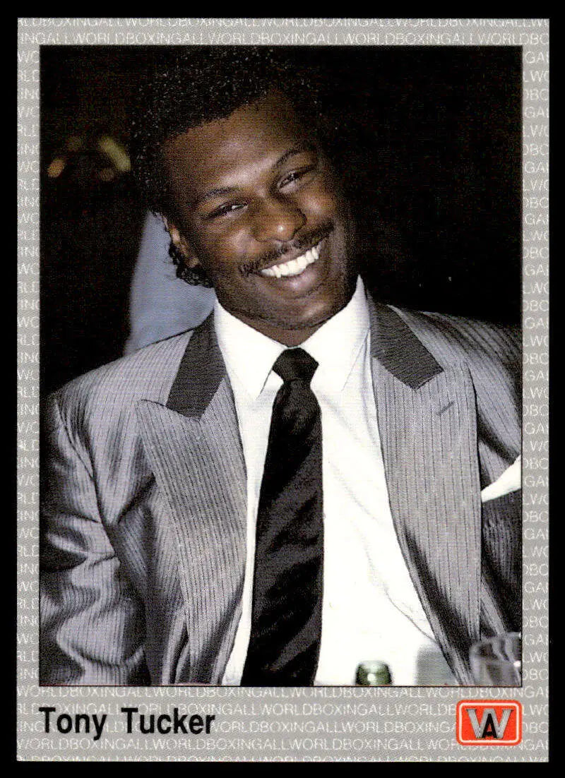 Smiling person in gray suit and black tie on 1991 Tony Tucker NM-MT Boxing Card