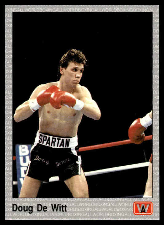 Shirtless Doug Dewitt in black shorts and red gloves, featured on a boxing card