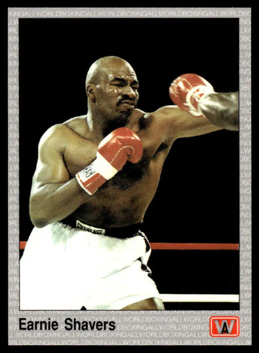 Earnie Shavers in white shorts and red gloves during a fight for boxing card collectors
