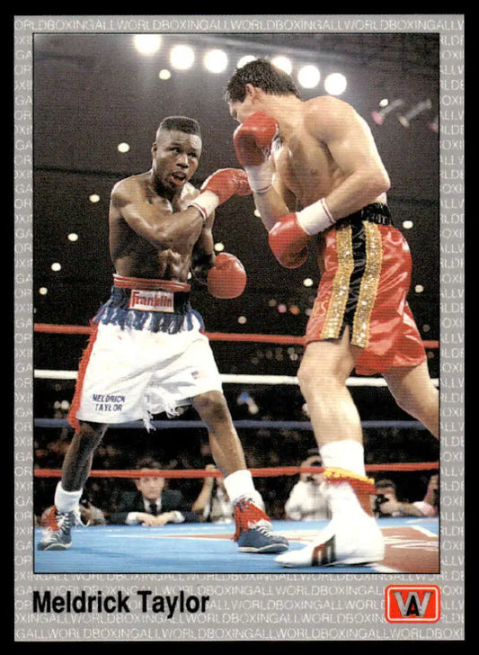 Two boxers in combat showcasing Meldrick Taylor on a boxing card NM-MT condition