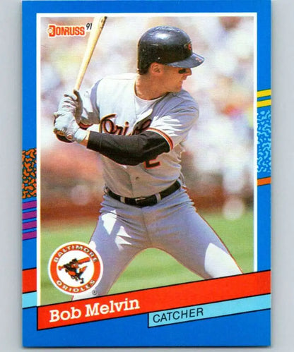1991 Donruss baseball card of Bob Melvin, Baltimore Orioles catcher at bat