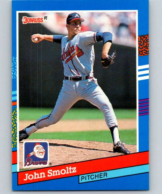 1991 Donruss John Smoltz UER baseball card showing Atlanta Braves pitcher mid-throw