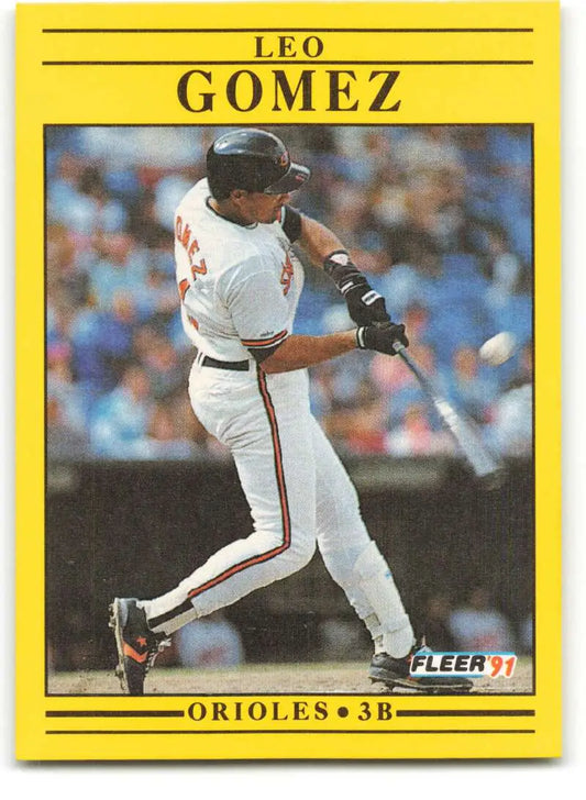 Baseball card of Leo Gomez in white Baltimore Orioles uniform mid-swing