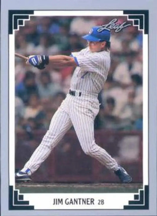 Baseball card of Jim Gantner swinging in pinstriped uniform for Milwaukee Brewers