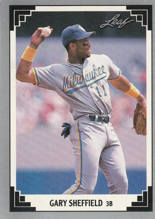 Gary Sheffield in a gray road uniform making a throw for the Milwaukee Brewers Baseball