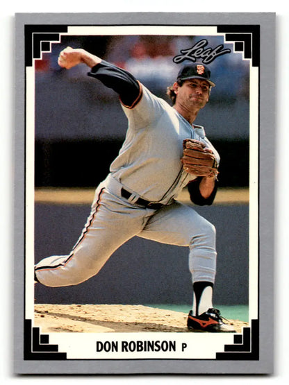 Baseball pitcher Don Robinson in white uniform delivering on San Francisco Giants card