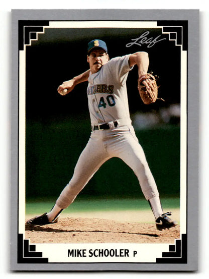 Baseball card of Mike Schooler in Seattle Mariners uniform mid-delivery pitch