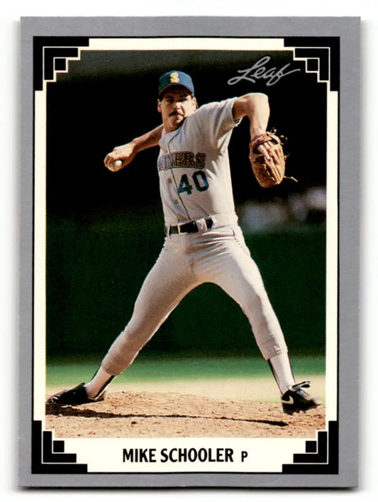 Baseball card of Mike Schooler in Seattle Mariners uniform mid-delivery pitch