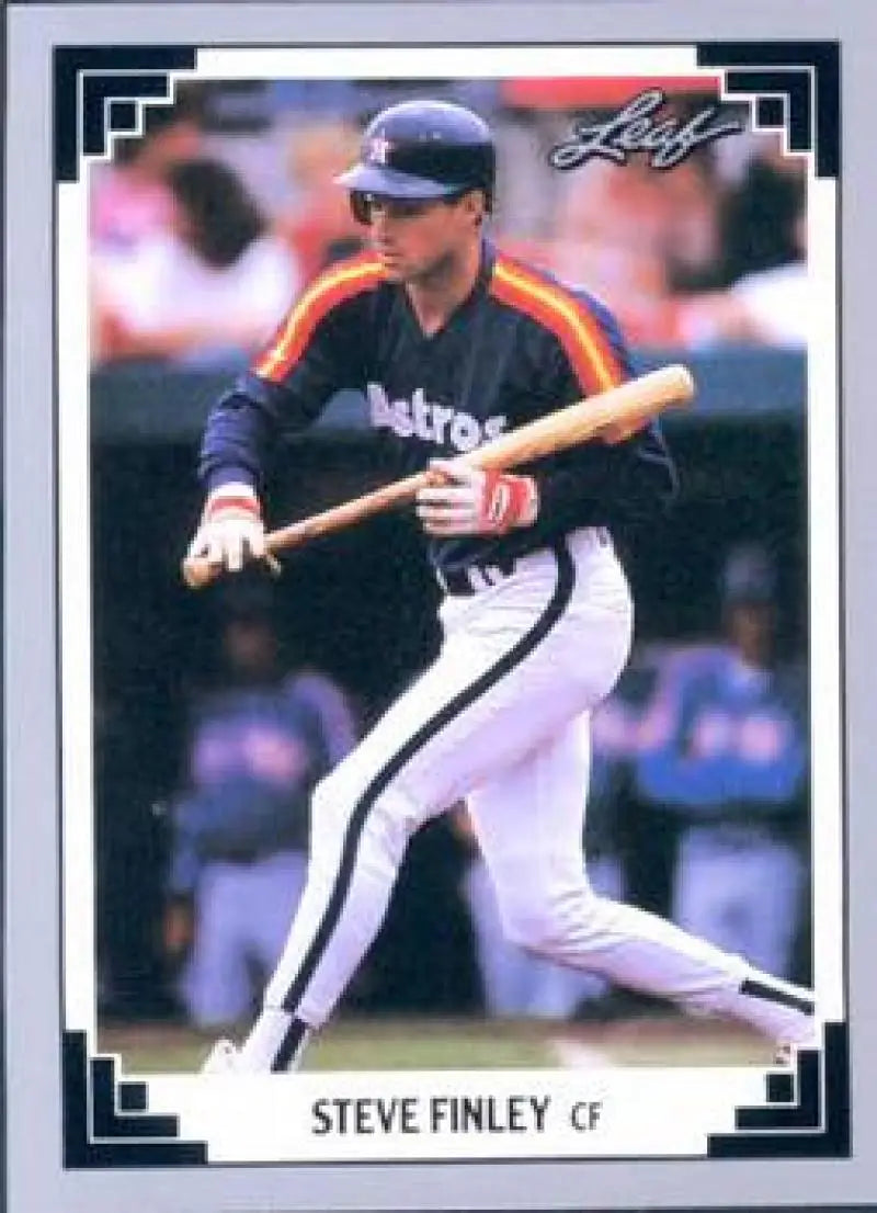 Steve Finley Astros baseball card showing player in rainbow-striped uniform batting stance
