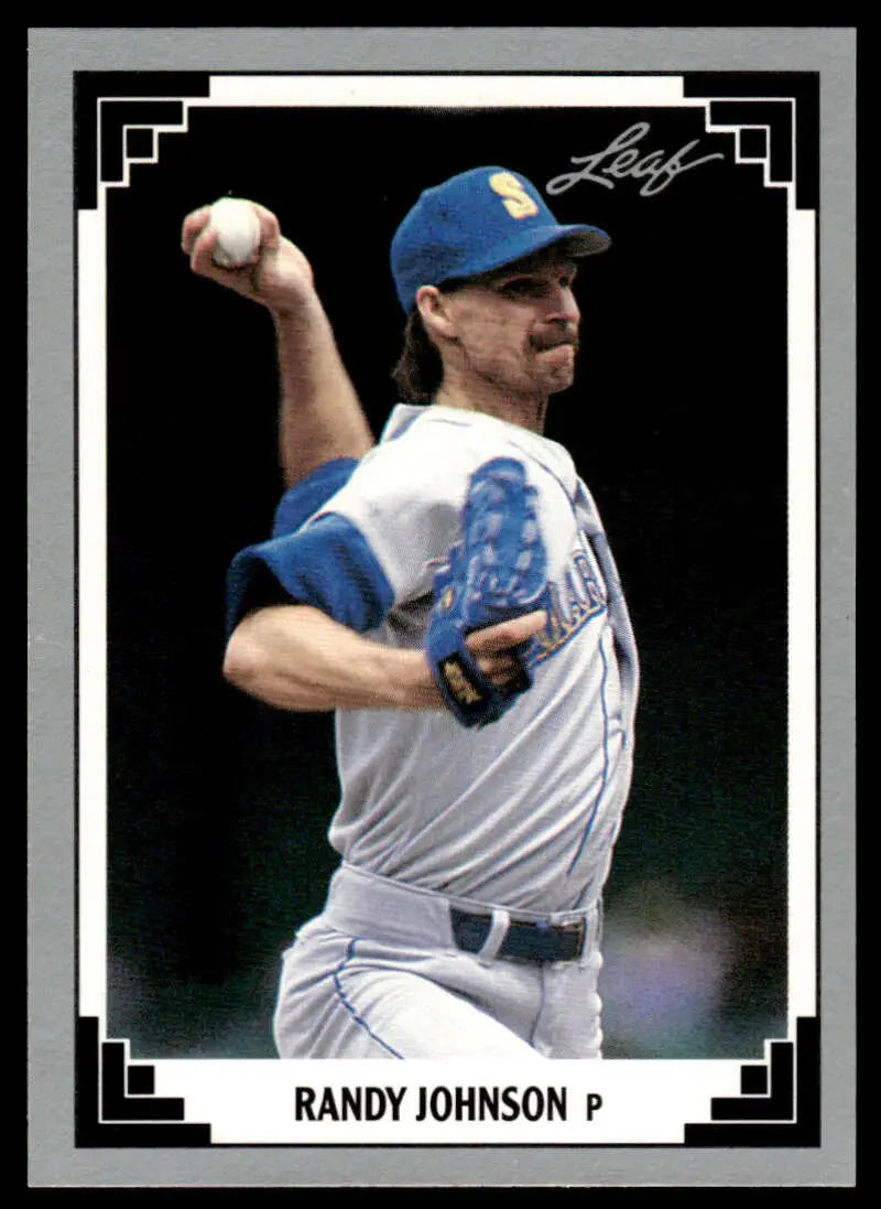 Randy Johnson mid-throw in white uniform on Seattle Mariners baseball card