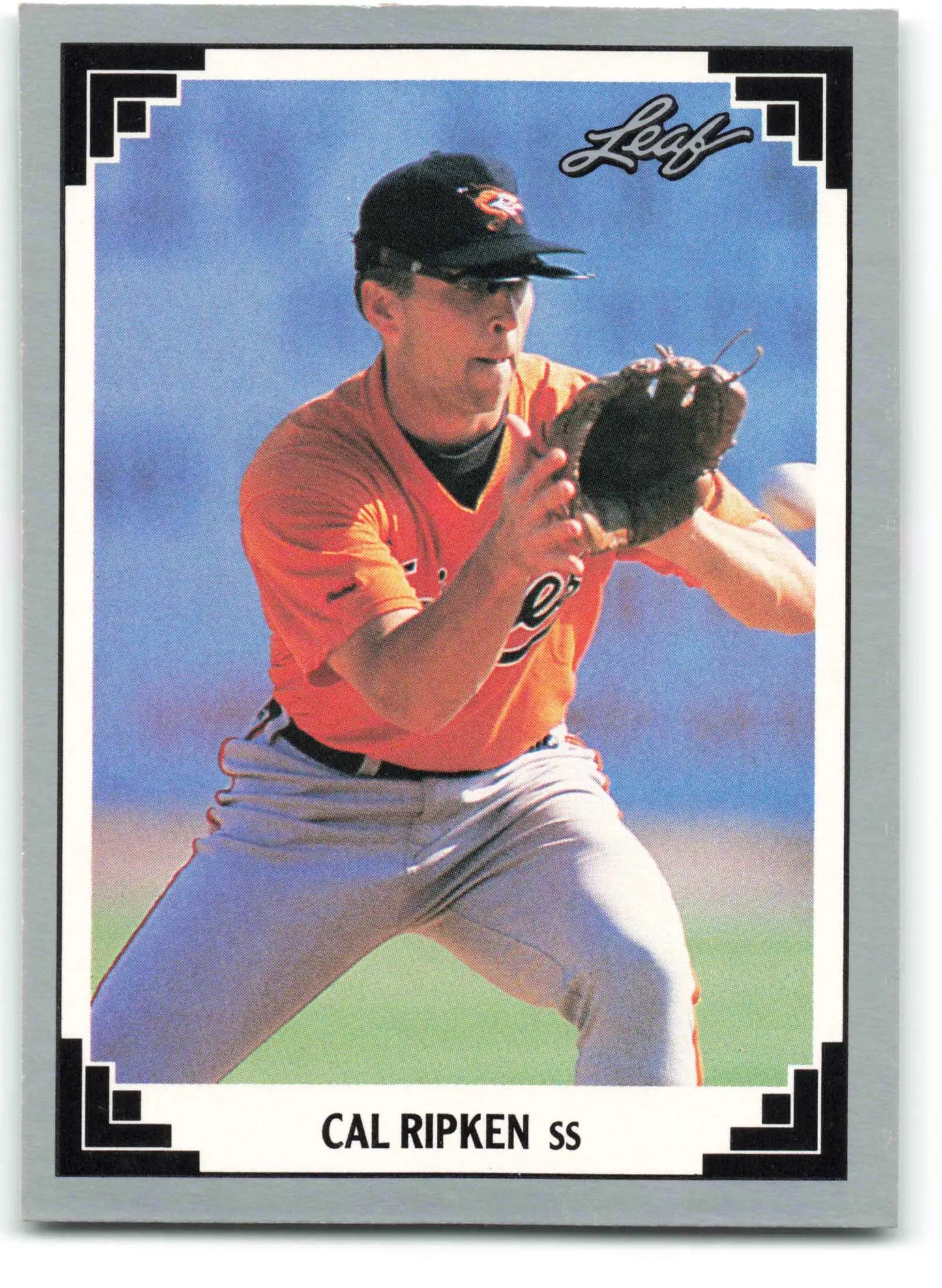 Cal Ripken Jr. Baltimore Orioles baseball card in orange jersey fielding position