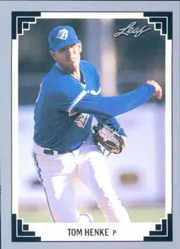 Baseball player in blue Toronto Blue Jays uniform mid-pitch for 1991 Leaf card