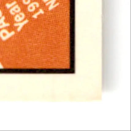 Corner of an orange paper card with black border from Pacific Football Steve Young San Francisco 49ers collectible
