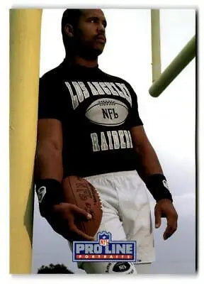 Football player Steve Smith holding a football from 1991 Pro Line Portraits