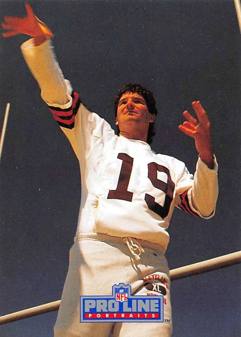 Bernie Kosar in a white jersey reaching up, featured in Pro Line Portraits for Cleveland Browns
