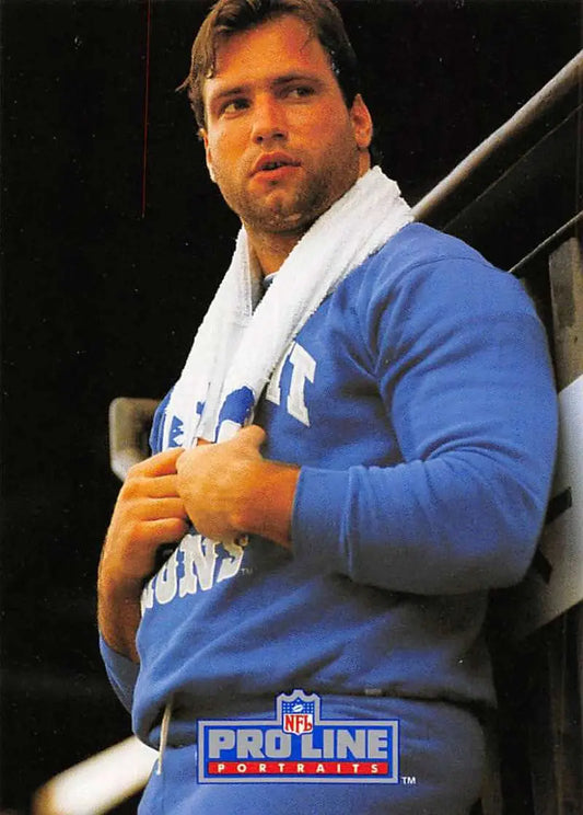 Person in bright blue NFL Pro Line sweatshirt with towel, showcasing Chris Spielman