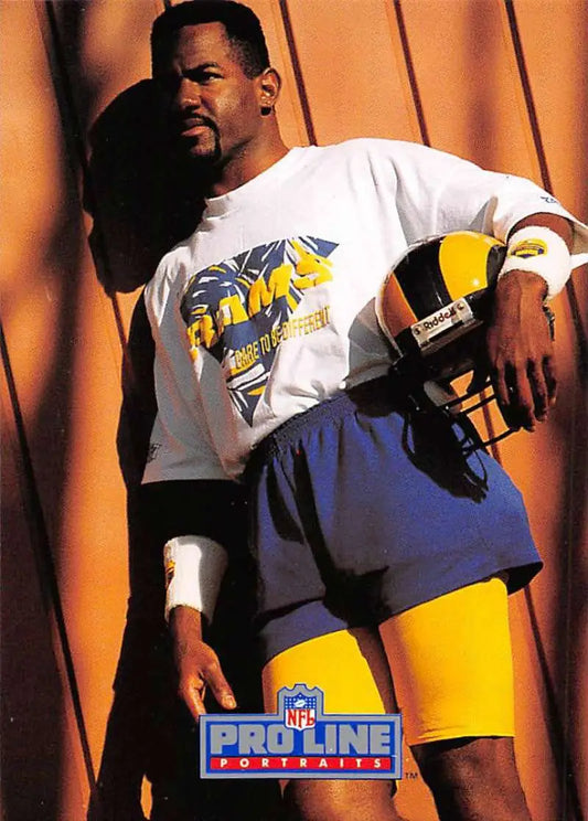 Henry Ellard in white t-shirt and blue shorts with yellow football helmet for Los Angeles Rams