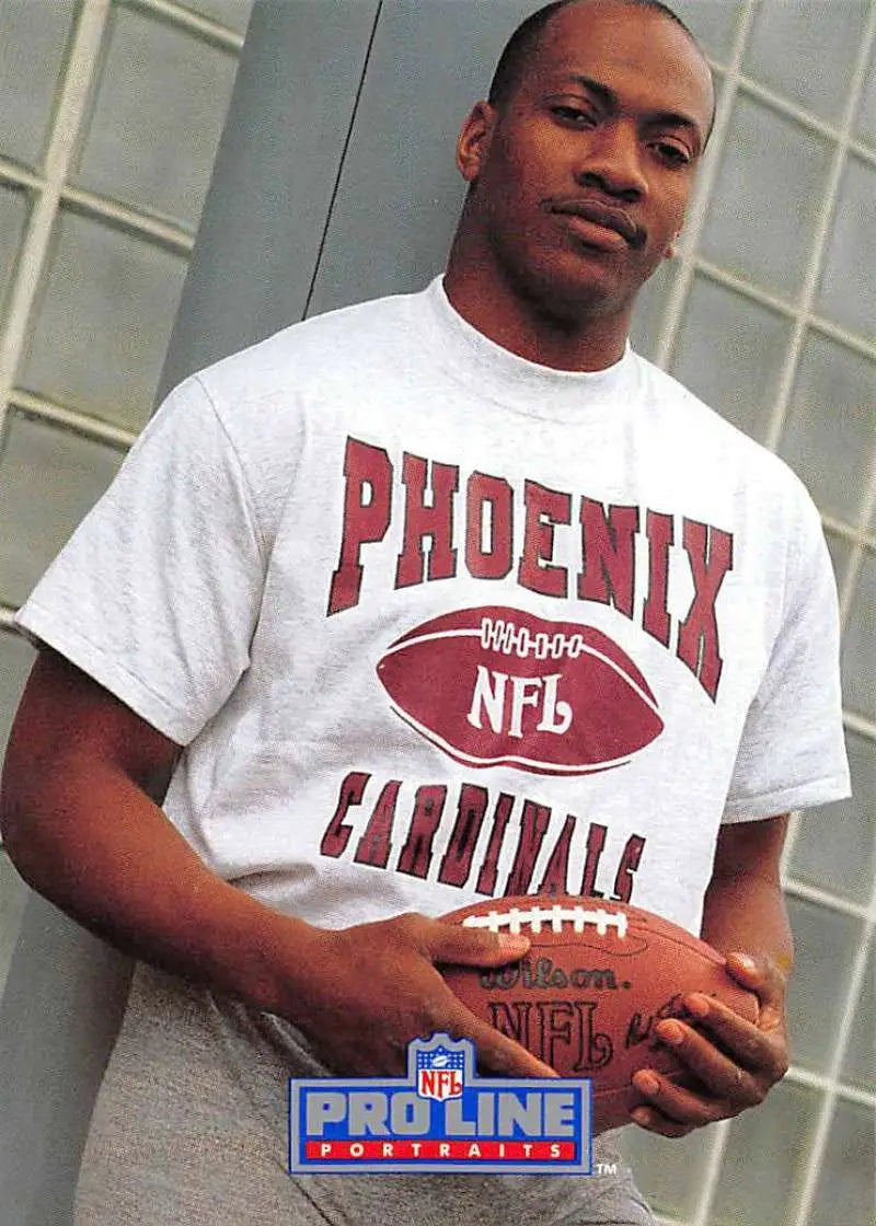 White t-shirt featuring Tim McDonald and Phoenix Cardinals NFL branding with football graphic